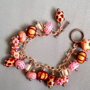 NEW BEAUTIFUL PINK, TAN AND BROWN LAMP WORK CHARM BRACELET